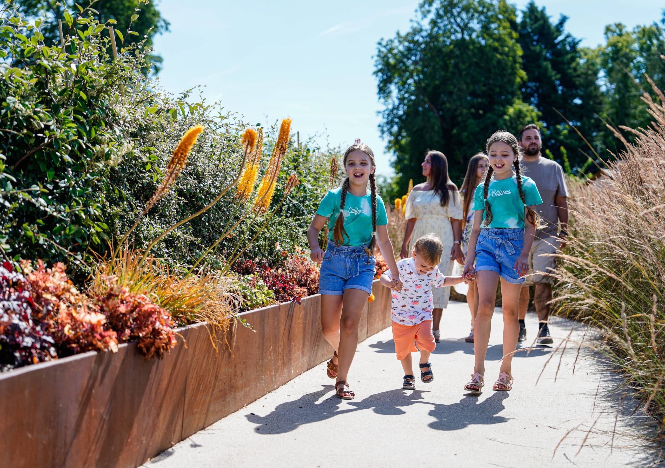The whole family walking around at Adventure play